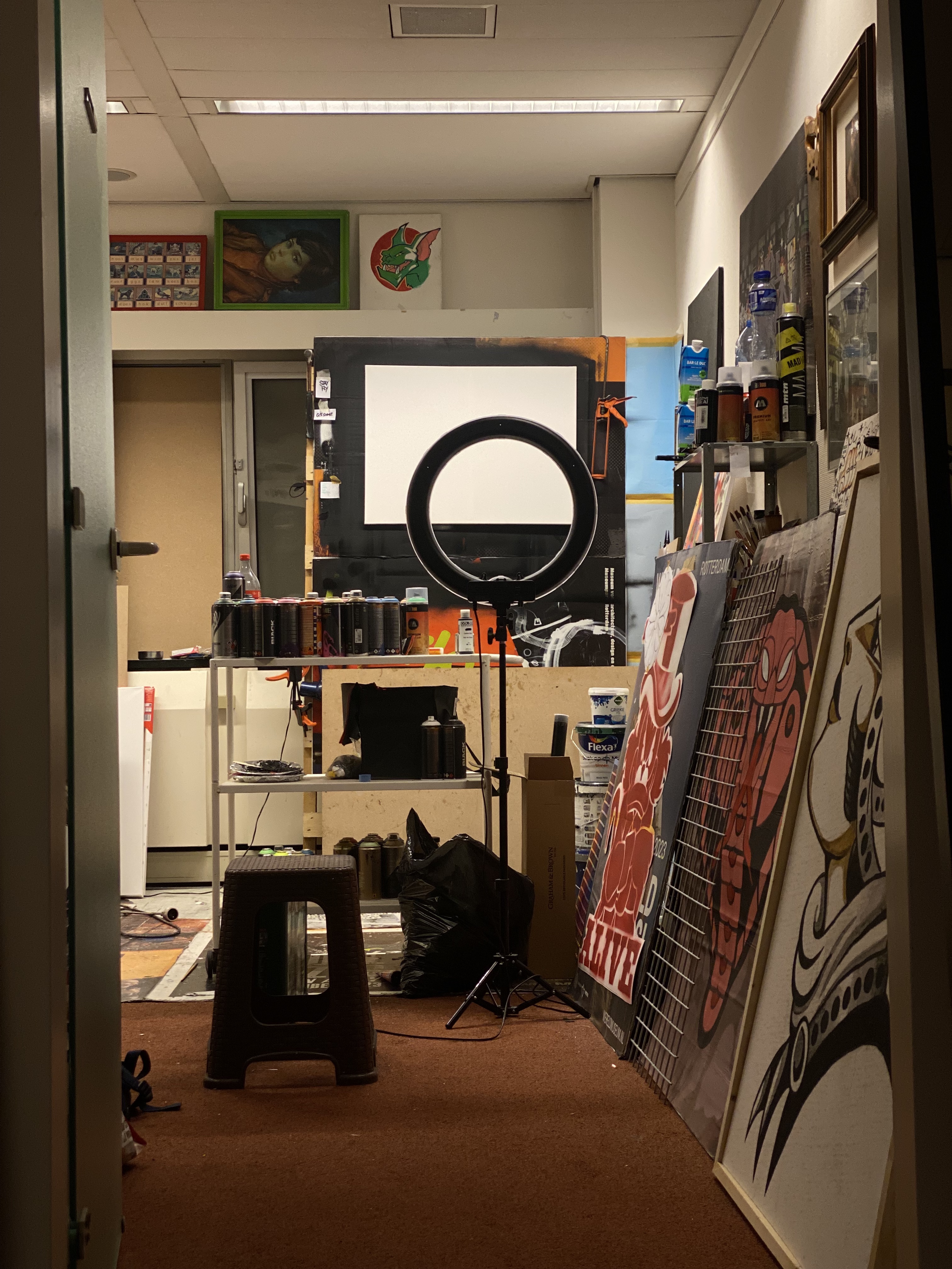 Geoffrey Zijffers' studio showing easel, canvases and paint setup
